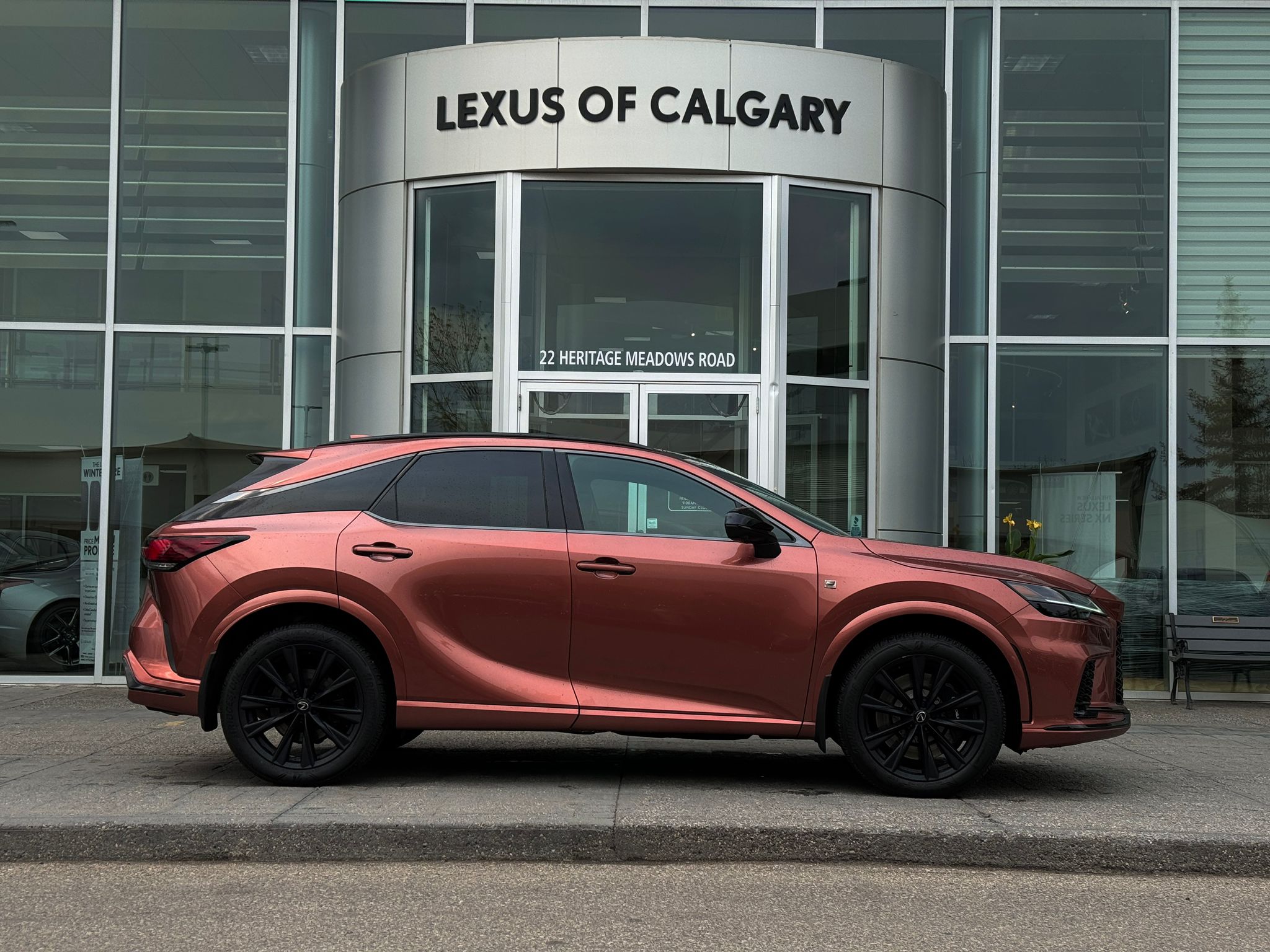 Lexus SUV parked in front of Lexus of Calgary dealership at 22 Heritage Meadows Road